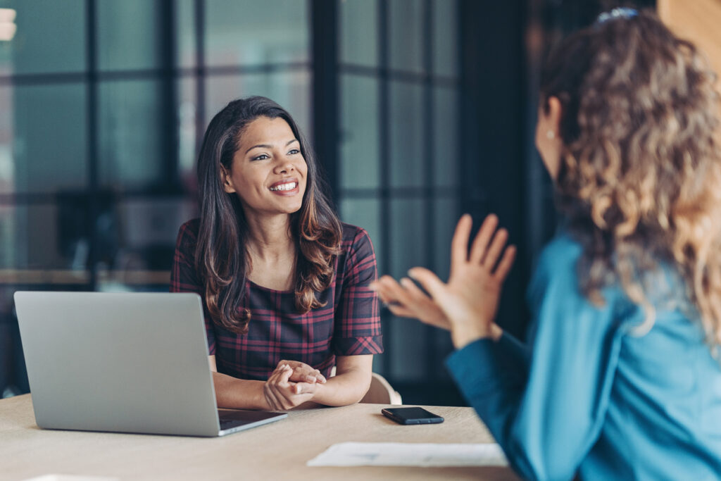 Decorative. Employee background screening meeting between HR and a new starter.